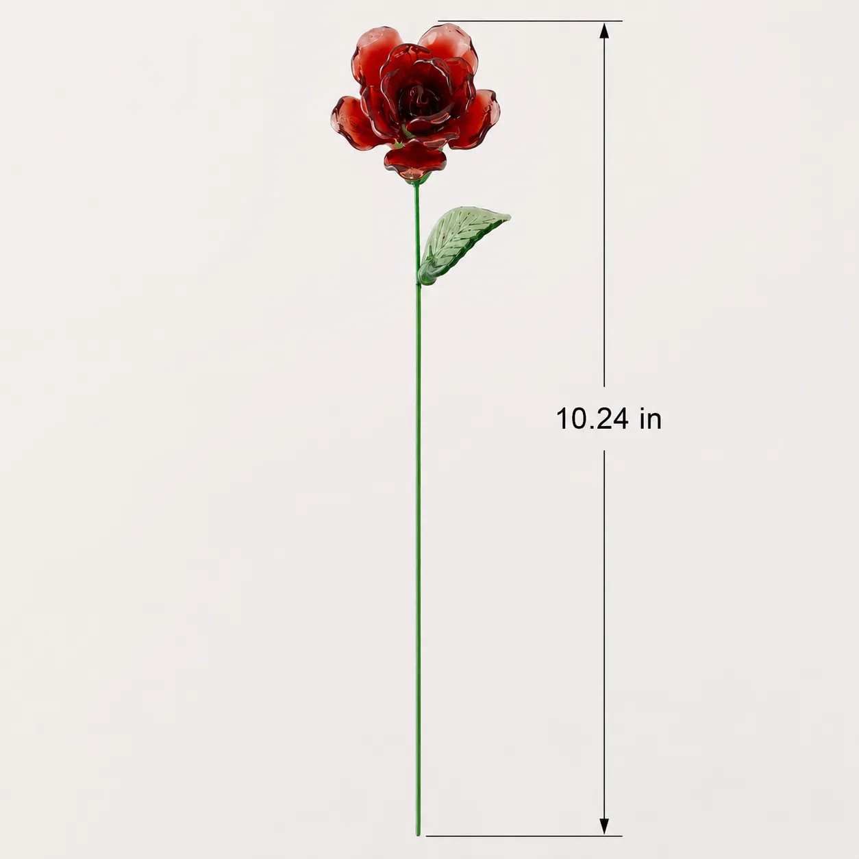 Single stem red glass rose displayed in a clear vase for home decor